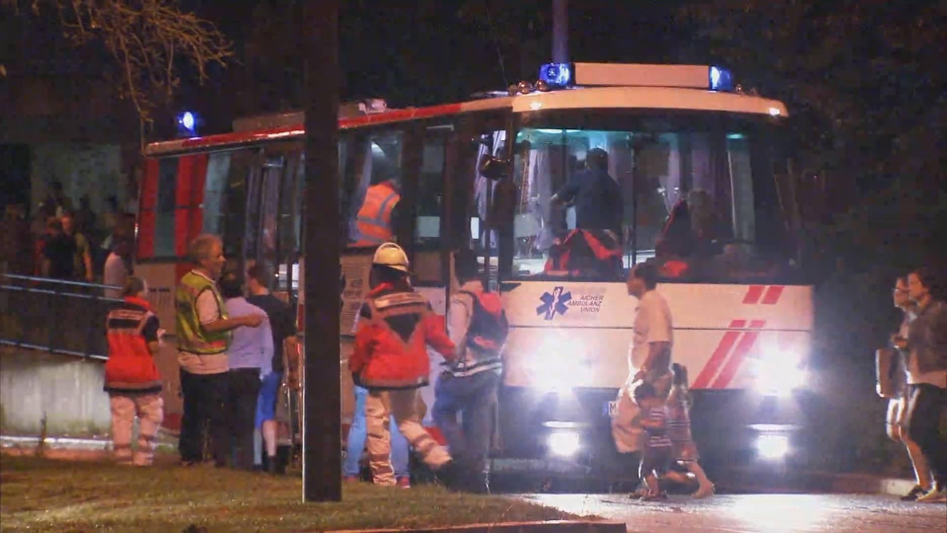 Screen grab shows people being evacuated onto bus following shooting rampage at shopping mall in Munich