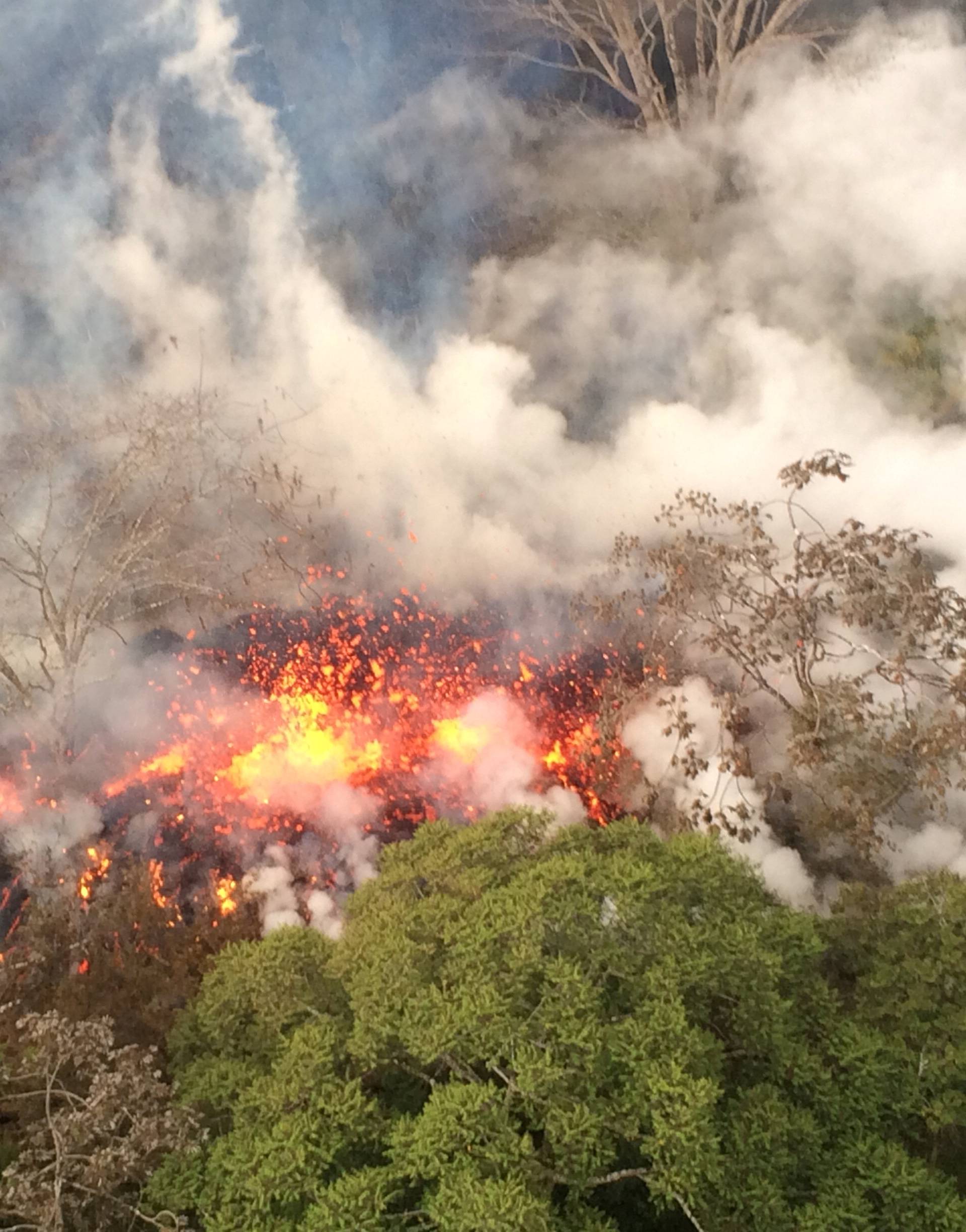 Lava spattering area from an area between fissures 16 and 20 is seen in Hawaii