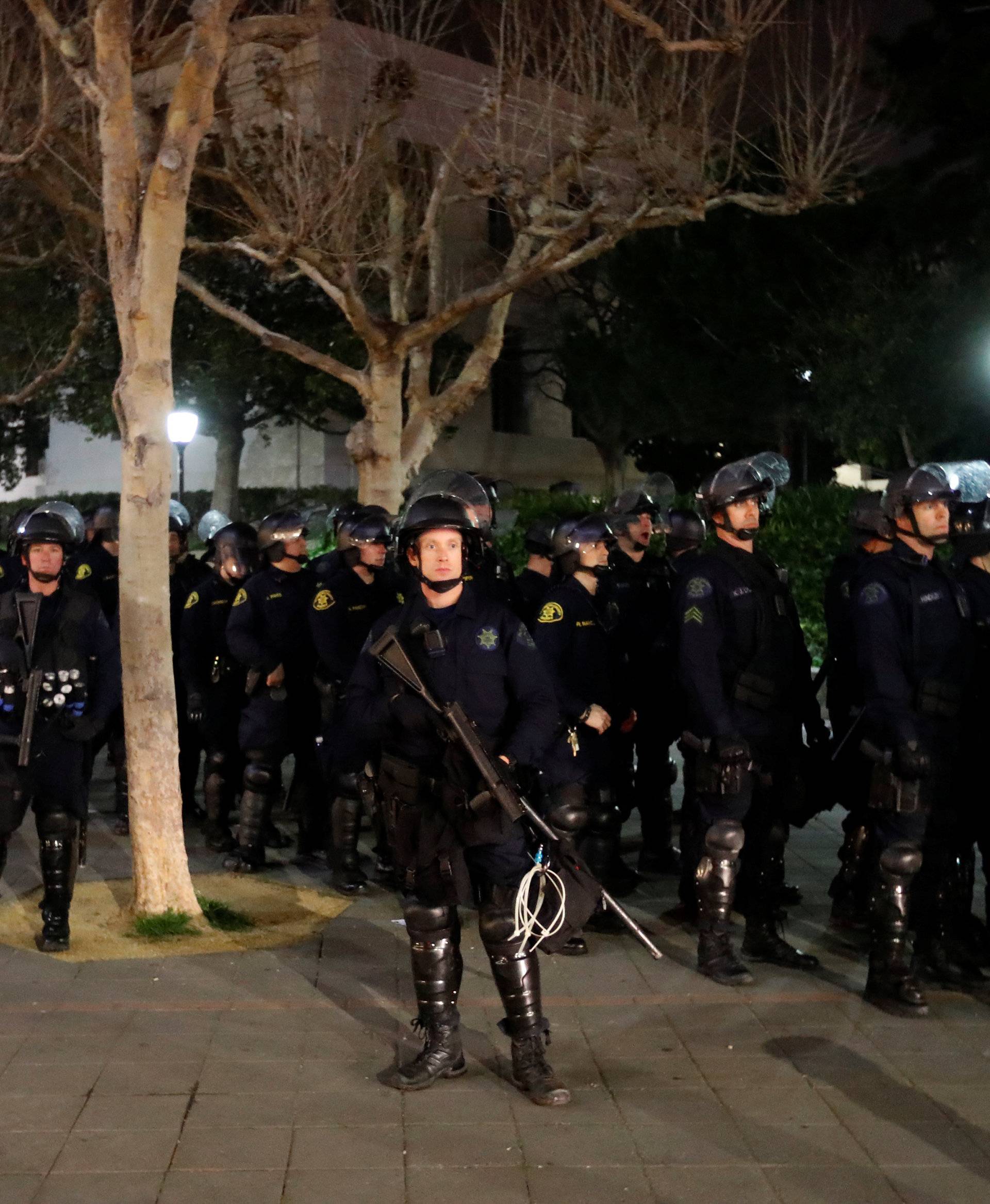 Police officers prepare to deploy a skirmish line at UC Berkeley