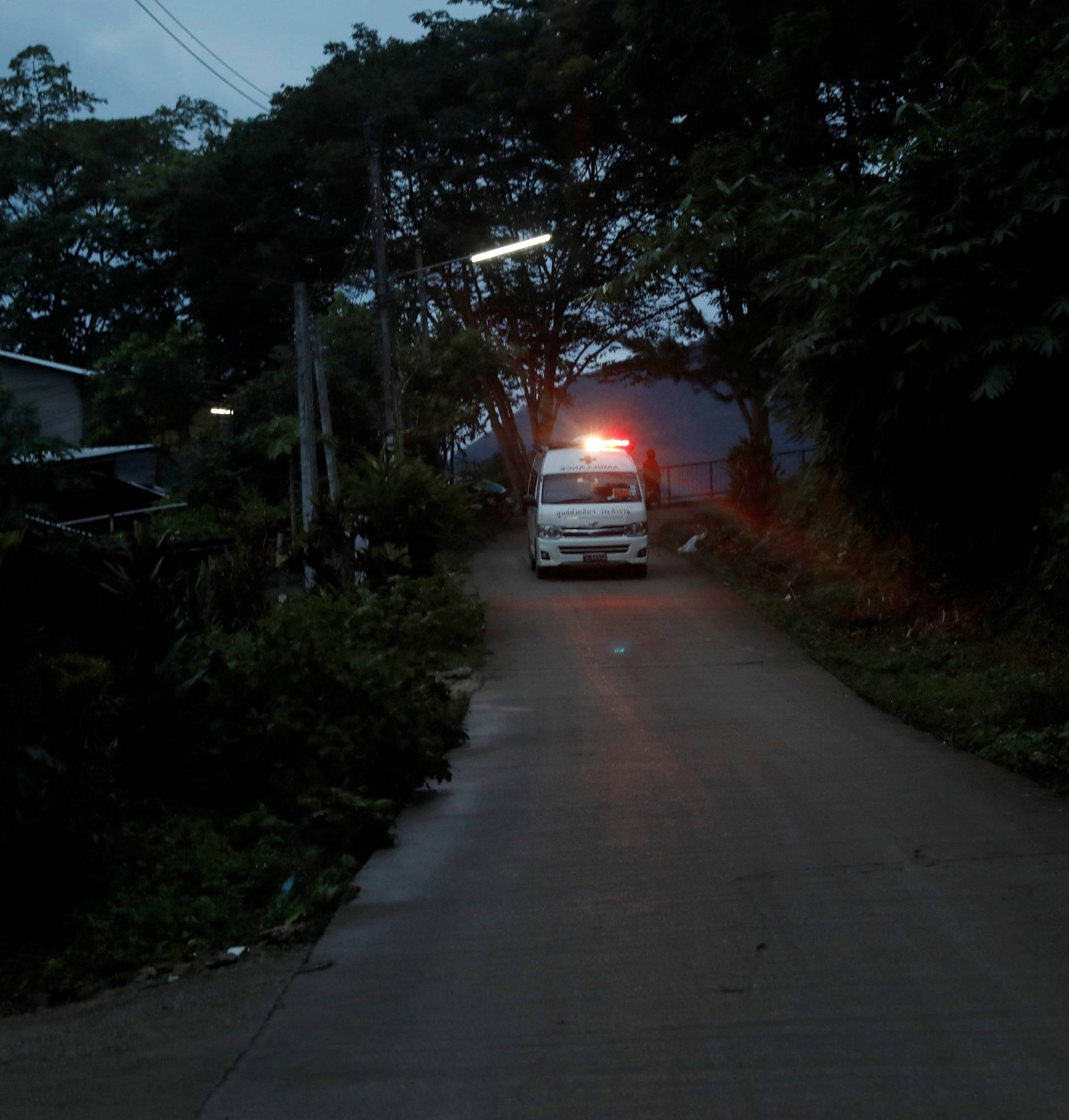 An ambulance believed to be carrying rescued schoolboys travels to a military helipad near Tham Luang cave complex in the northern province of Chiang Rai