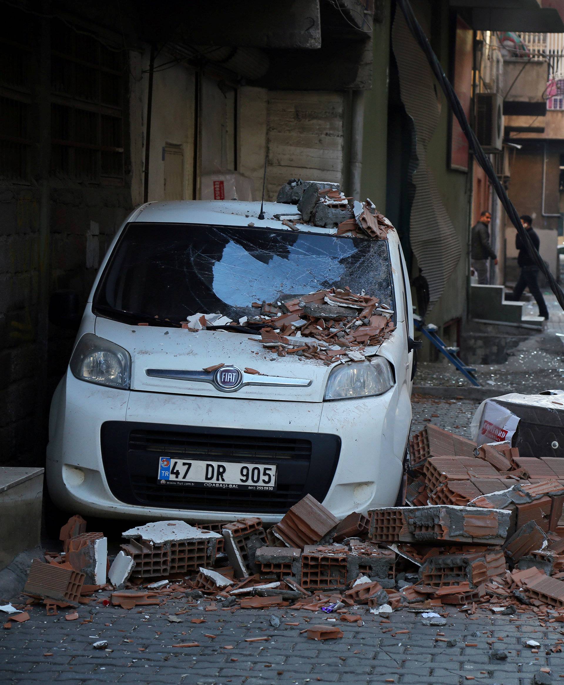 A damaged vehicle is seen after a blast in the Kurdish-dominated southeastern city of Diyarbakir