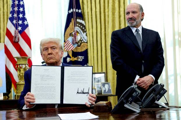 FILE PHOTO: U.S. President Donald Trump signs executive orders for reciprocal tariffs in Washington