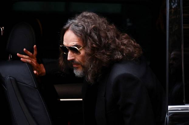 British actor and comedian Russell Brand stands trial on charges of rape and sexual assault, in London