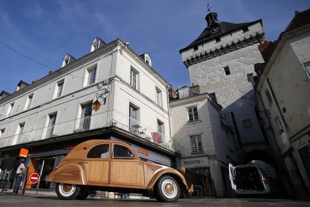 Michel Robillard, a french cabinet maker, drives his hand-built 2CV Citroen car made out of fruitwood in Loches