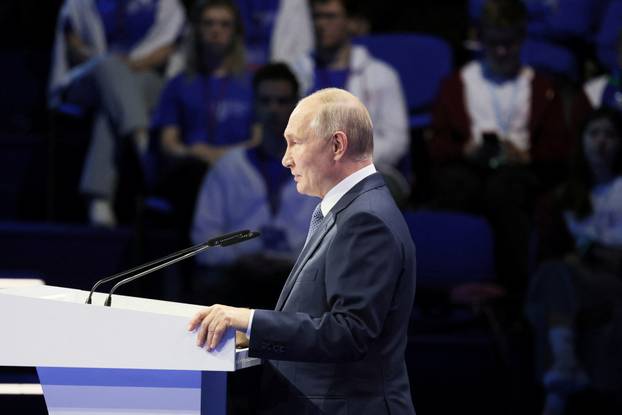 Russian President Vladimir Putin attends a plenary session as part of the 3rd International Olympiad on Financial Security in the Sirius Park of Science and Art in Krasnodar region