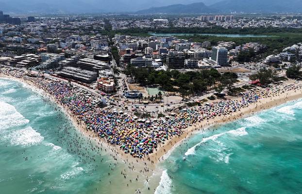 A drone view shows people enjoying the Macumba beach, during a heatwave in Rio de Janeiro