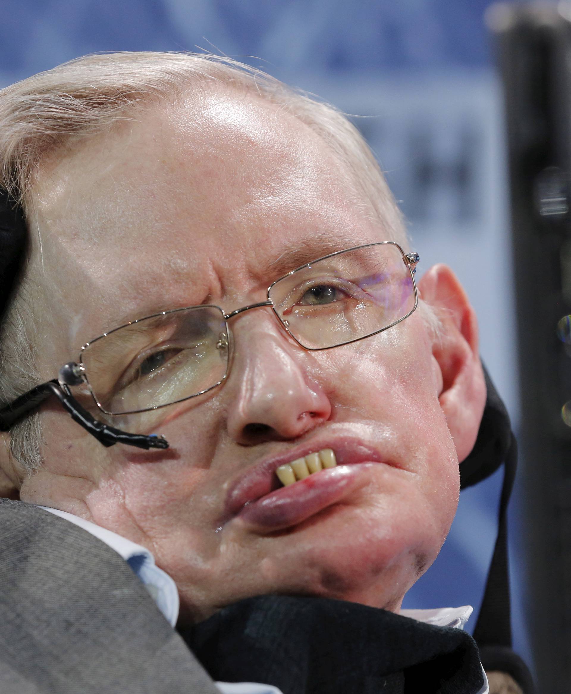 FILE PHOTO: Physicist Stephen Hawking sits on stage during an announcement of the Breakthrough Starshot initiative with investor Yuri Milner in New York