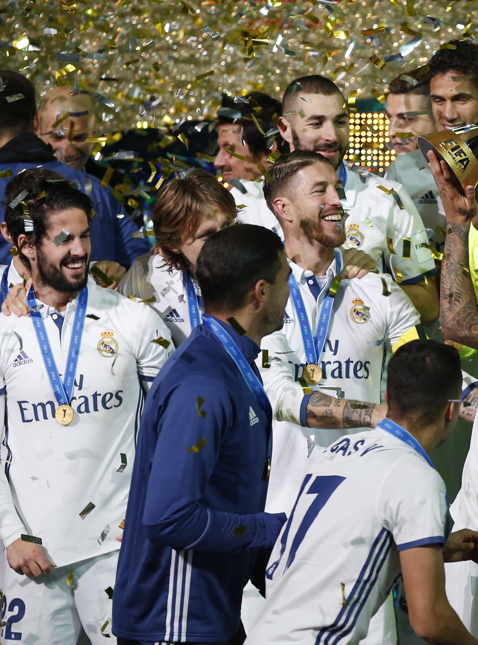 Real Madrid's Marcelo and team mates celebrate winning the FIFA Club World Cup Final with the trophy