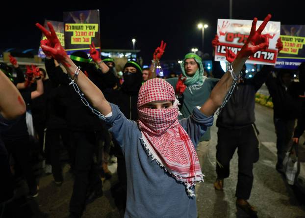 Israelis protest a ceasefire deal, in Jerusalem