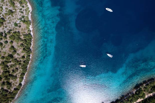 A drone view shows anchored boats in the Nature park Telascica on Dugi Otok