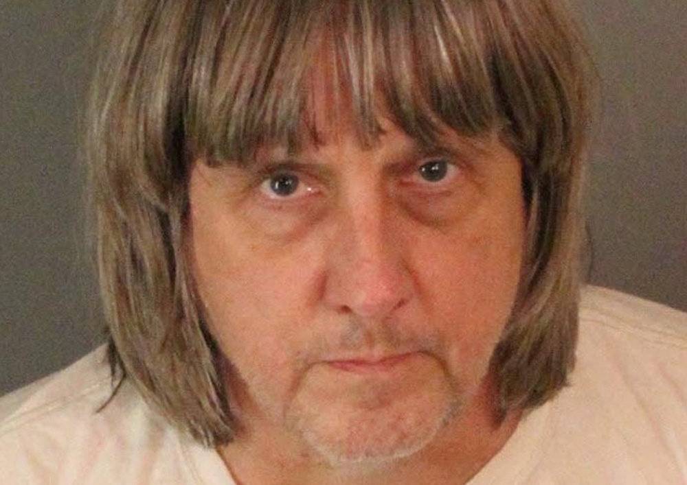 Turpin appears in a police booking photo in Riverside