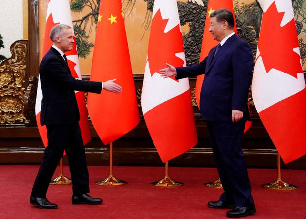 FILE PHOTO: Canadian Prime Minister Mark Carney meets with President of China Xi Jinping at the Great Hall of the People in Beijing