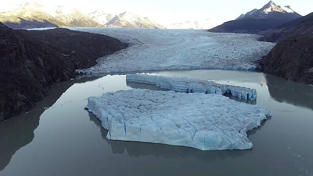 Two new icebergs are seen after breaking off from the Grey glacier in Patagonia