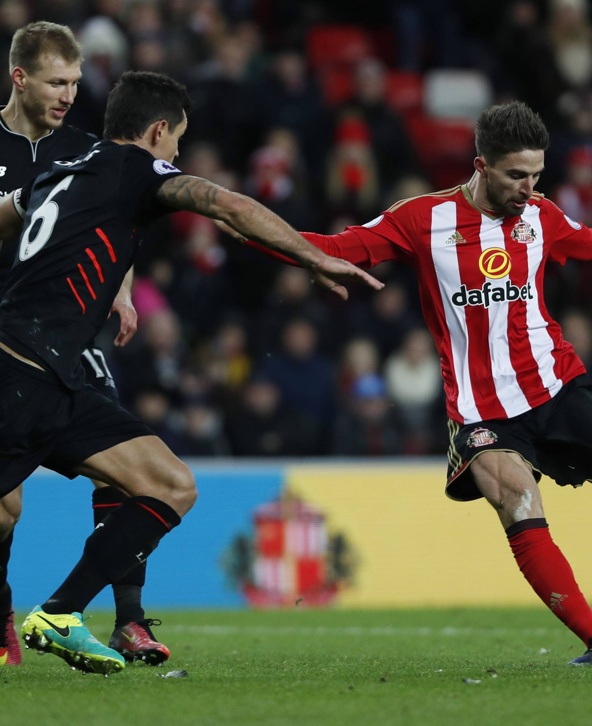 Sunderland's Fabio Borini in action with Liverpool's Dejan Lovren
