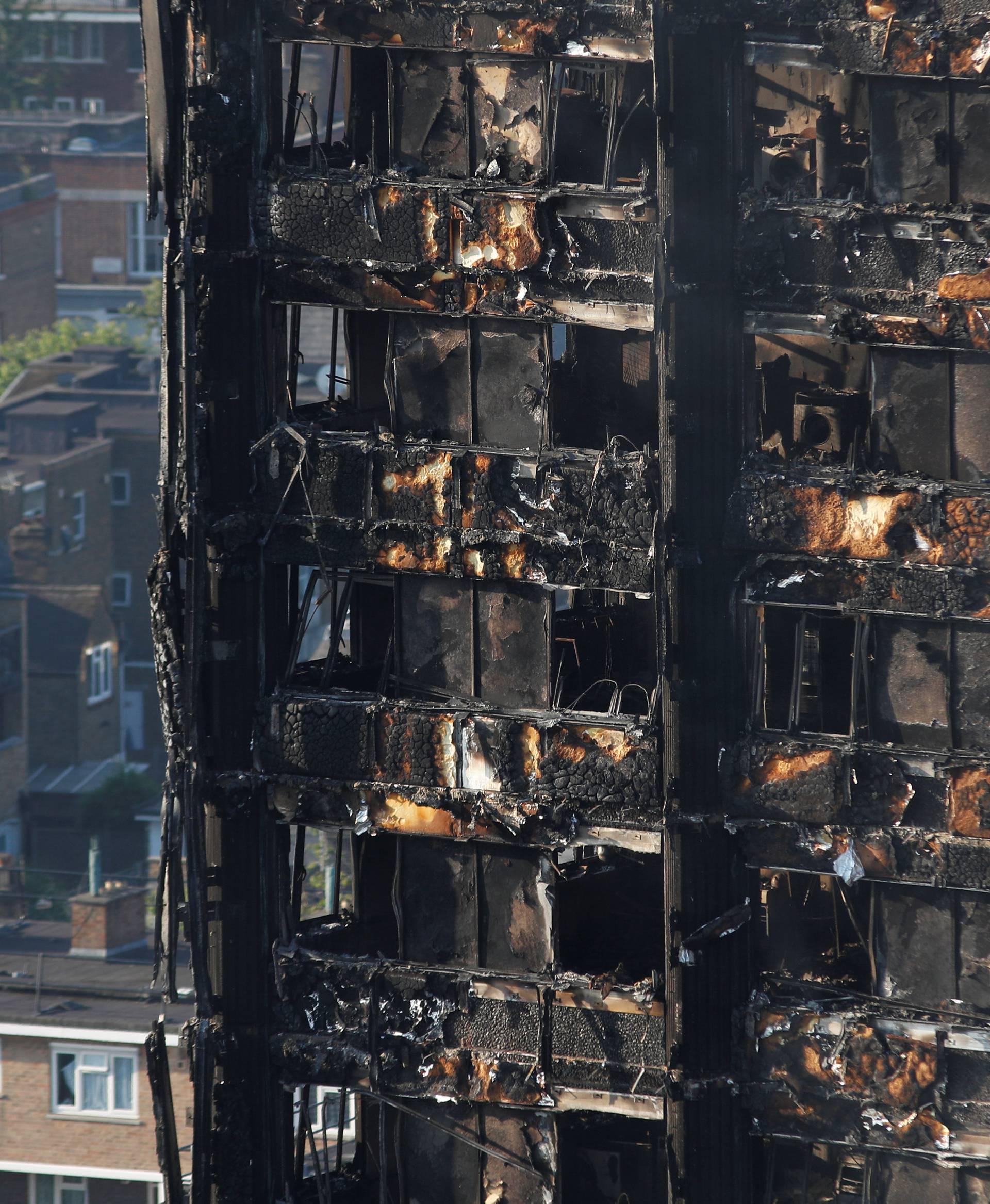 Damage is seen to a tower block which was destroyed in a fire disaster, in north Kensington, West London