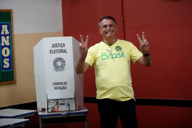 Brazil's President and presidential candidate Jair Bolsonaro gestures as he votes during presidential election run-off, in Rio de Janeiro,