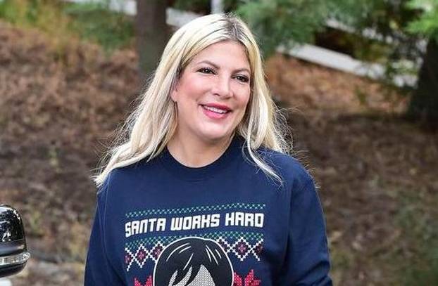 Tori Spelling Black Friday Shopping in an Ugly Kris Jenner Christmas Sweater