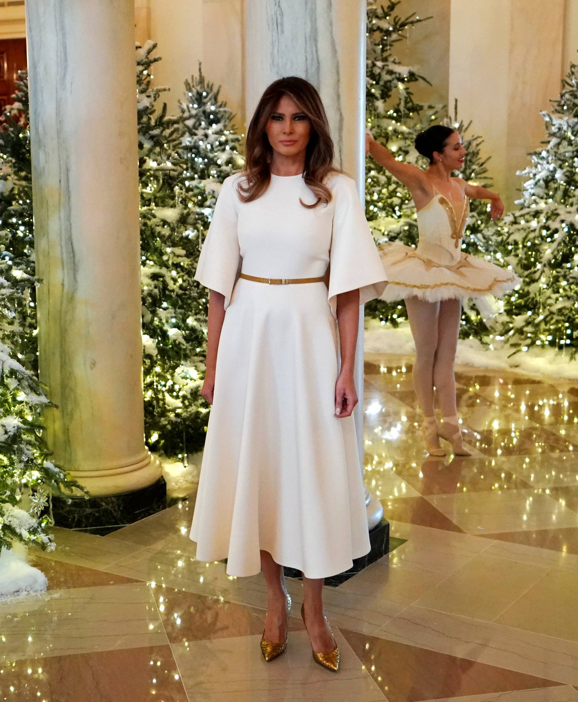 Trump tours the holiday decorations with reporters at the White House in Washington