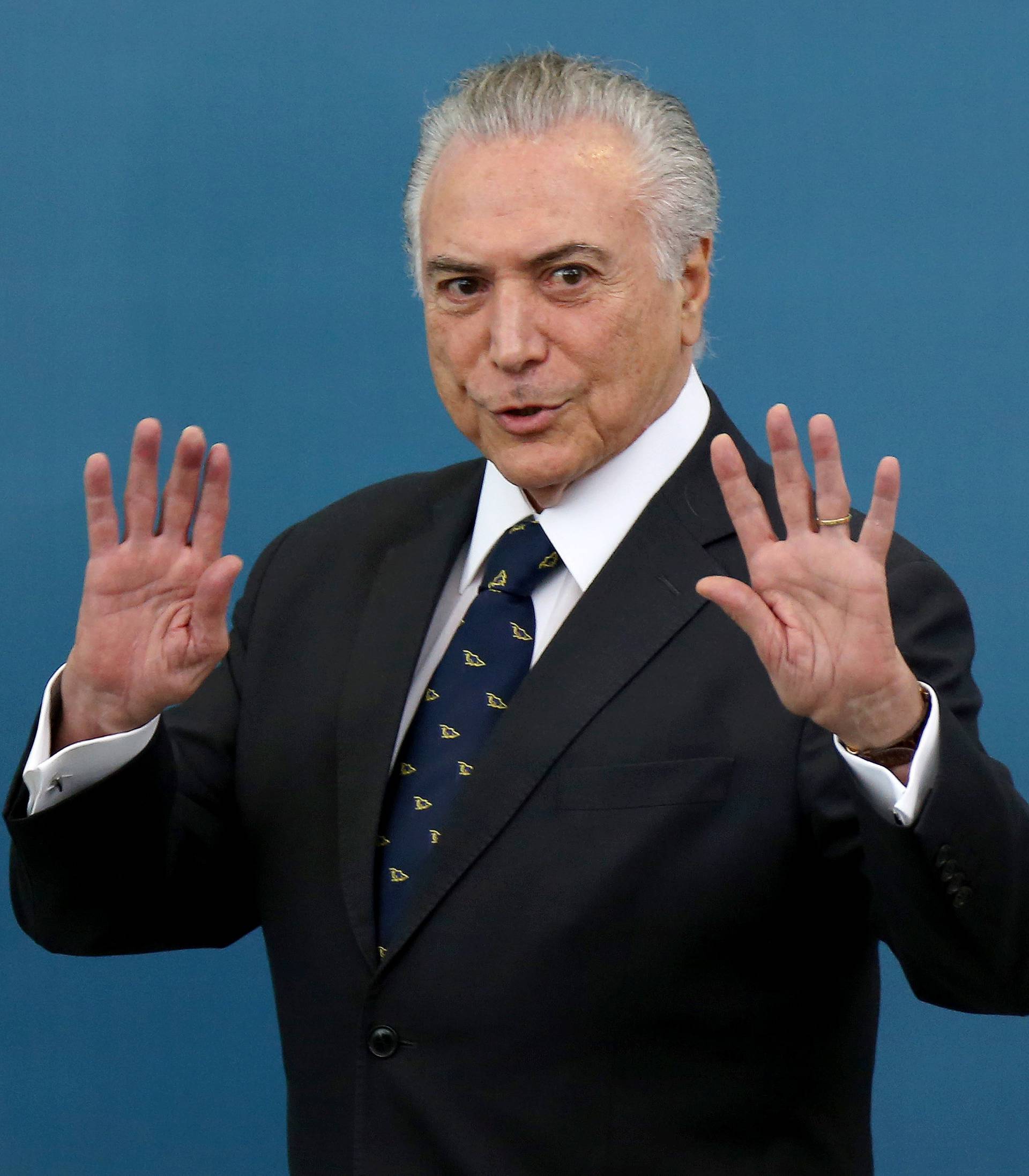 Brazil's President Michel Temer gestures during a ceremony at the Planalto Palace in Brasilia