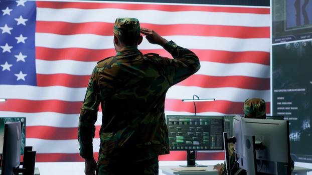 American military personnel supervising cyber war activity in high tech office