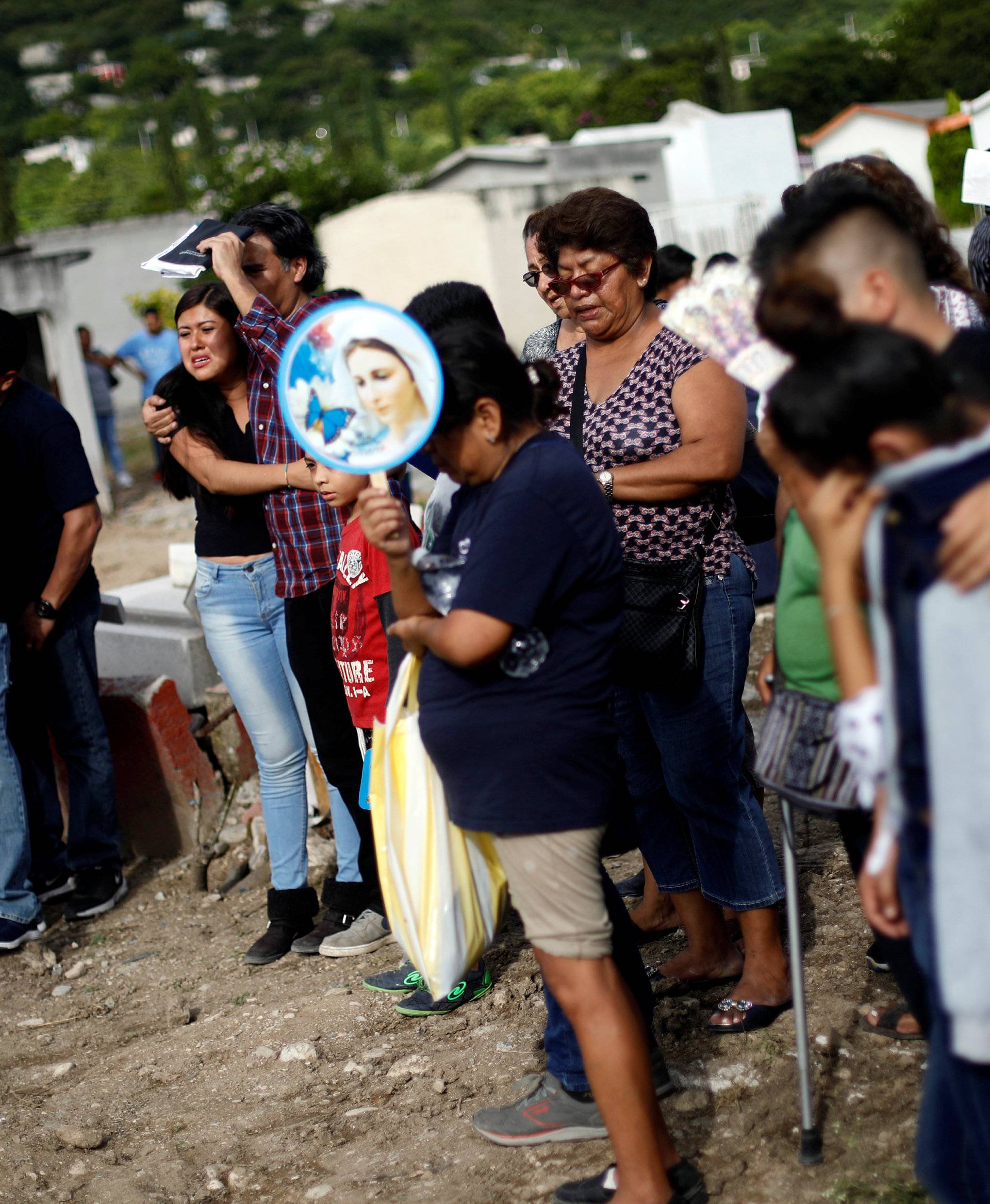 Family members and friends attend the funeral of a woman who was killed in an earthquake, in Jojutla de Juarez