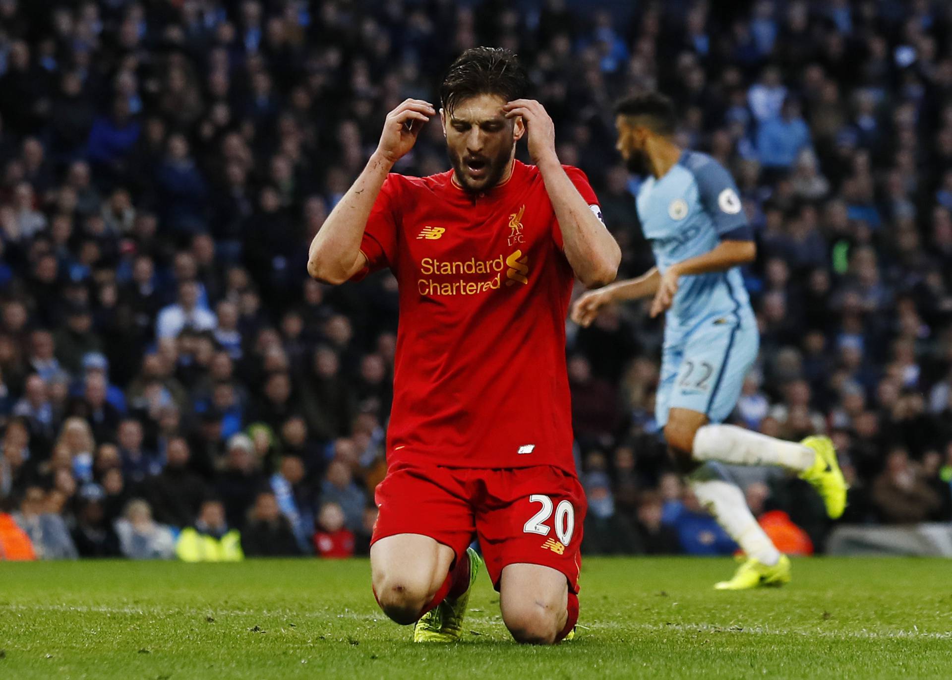 Liverpool's Adam Lallana looks dejected after a missed chance
