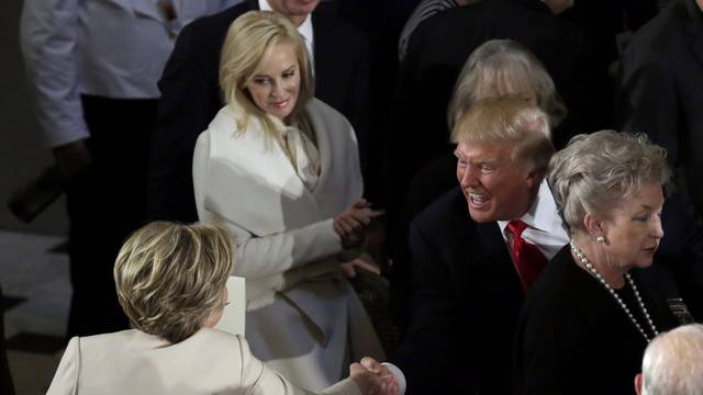 Donald Trump shakes hands with Hillary Clinton during the Inaugural luncheon at the National Statuary Hall in Washington