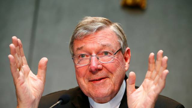 FILE PHOTO - Cardinal George Pell gestures as he talks during a news conference for the presentation of new president of Vatican Bank IOR, at the Vatican