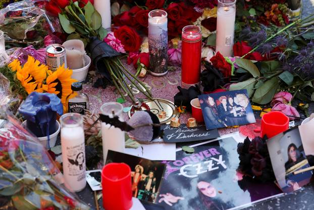 Flowers and pictures are placed on the star of late Ozzy Osbourne at the Hollywood Walk of Fame in Los Angeles