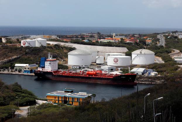 FILE PHOTO: A crude oil tanker is docked at Isla Oil Refinery PDVSA terminal in Willemstad on the island of Curacao
