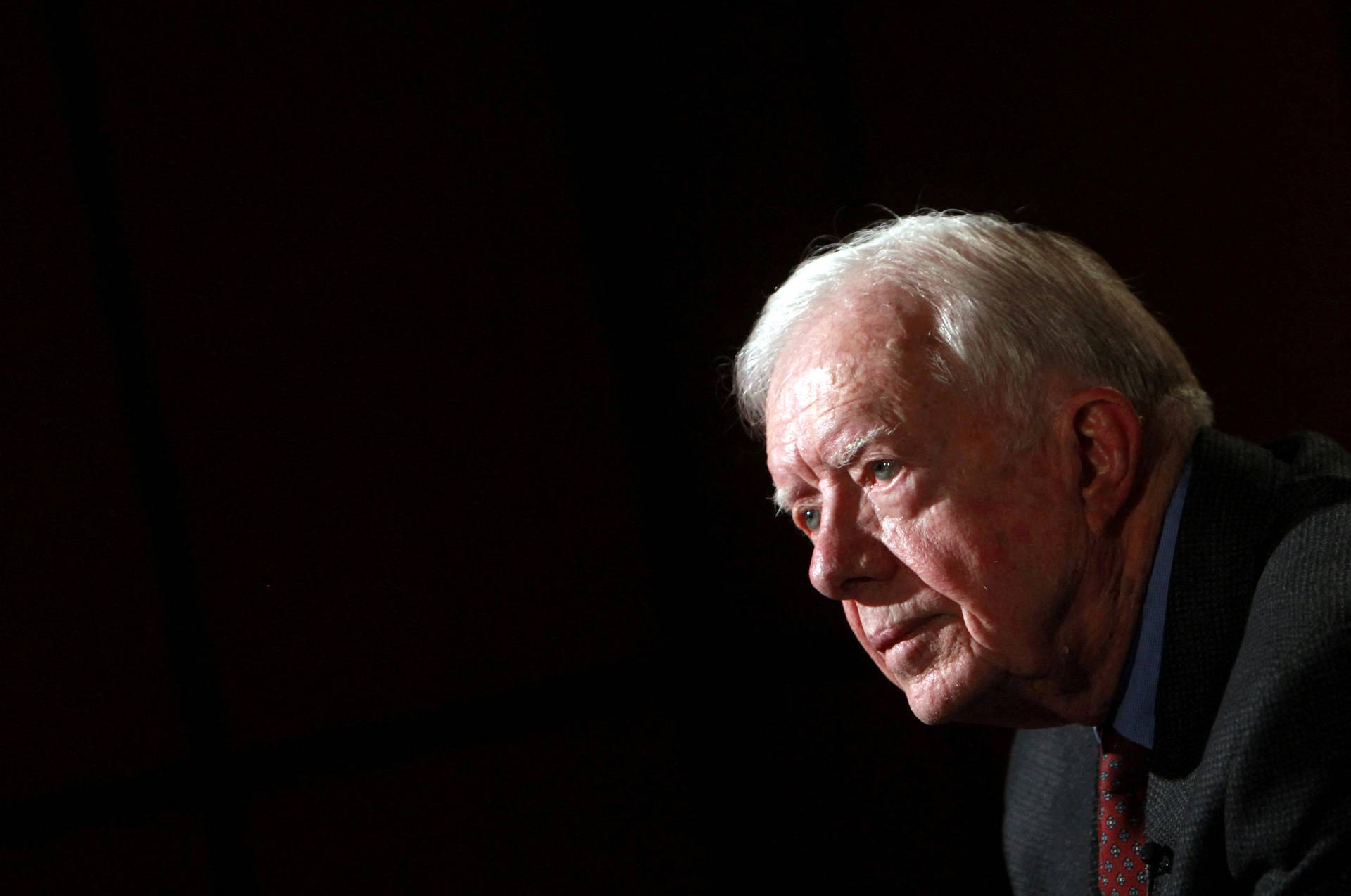 FILE PHOTO: Former U.S. President Jimmy Carter attends an interview with Reuters in Cairo