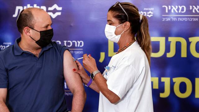 Israeli Prime Minister Naftali Bennett receives a third shot of COVID-19 vaccine in Kfar Saba