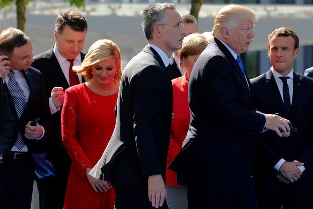 U.S. President Trump and NATO Secretary General Stoltenberg walk past Croatia