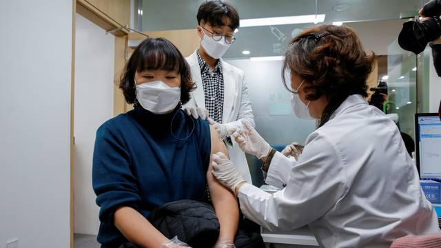 FILE PHOTO: A nursing home worker receives the AstraZeneca COVID-19 vaccine at a health care centre as South Korea starts a vaccination campaign against the coronavirus disease (COVID-19), in Seoul