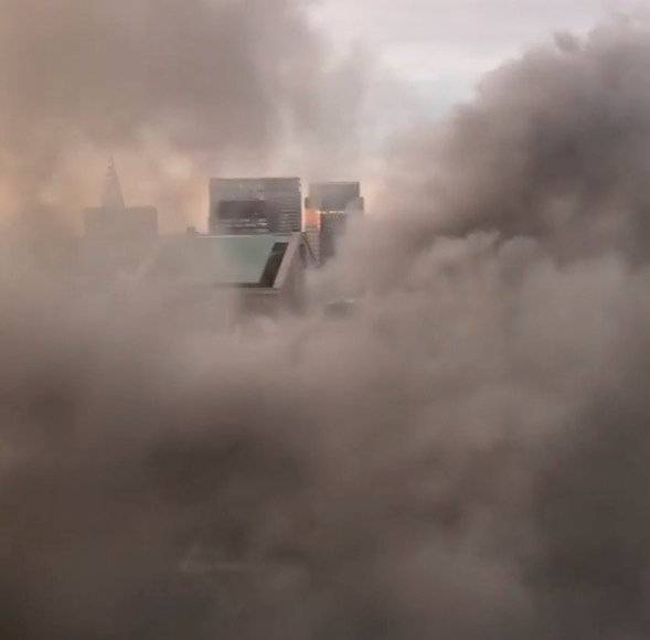 A smoke coming out of Trump Tower as seen from building next to it, in New York City