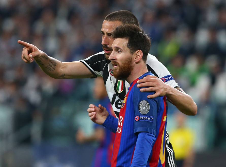 Juventus' Leonardo Bonucci speaks to Barcelona's Lionel Messi