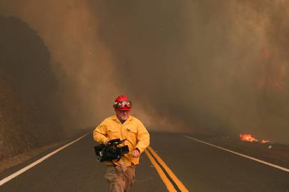 NBC News camerama takes cover from LNU Lightning Complex Fire  in Lake County, California