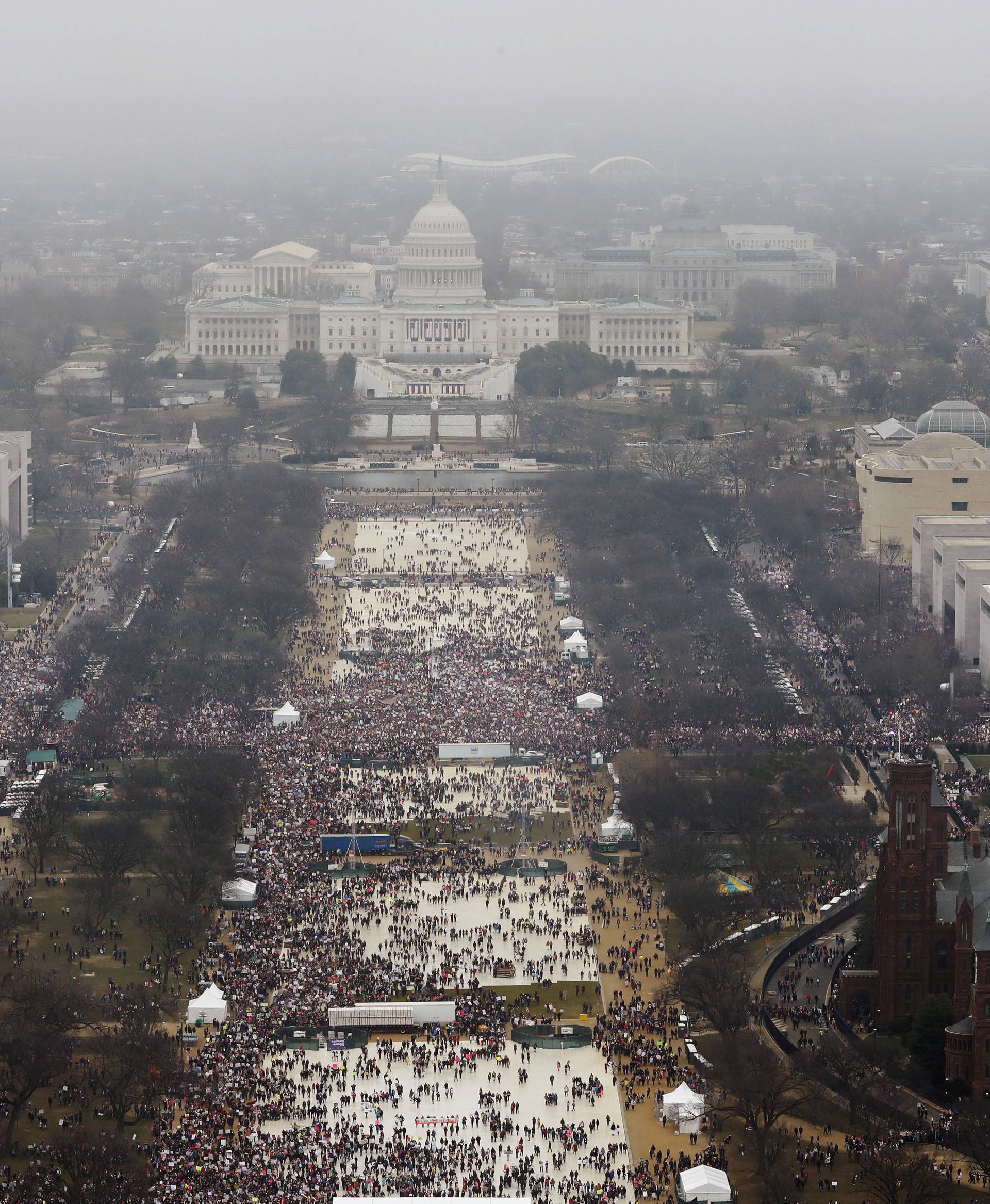 Demonstrators take part in the Women's March to protest Donald Trump's inauguration as the 45th president of the United States near the U.S. Capitol in Washington