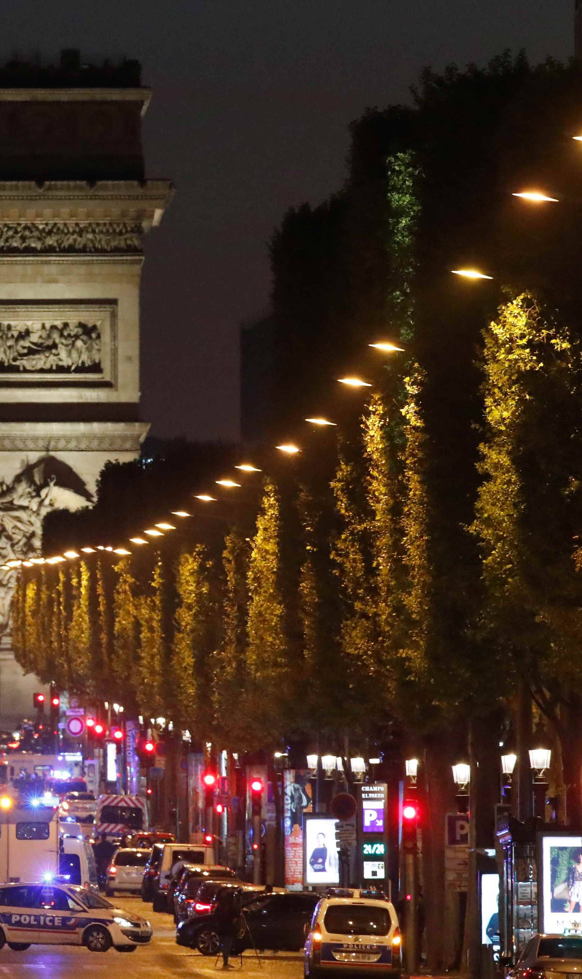 Police secure the Champs Elysees Avenue after one policeman was killed and another wounded in a shooting incident in Paris
