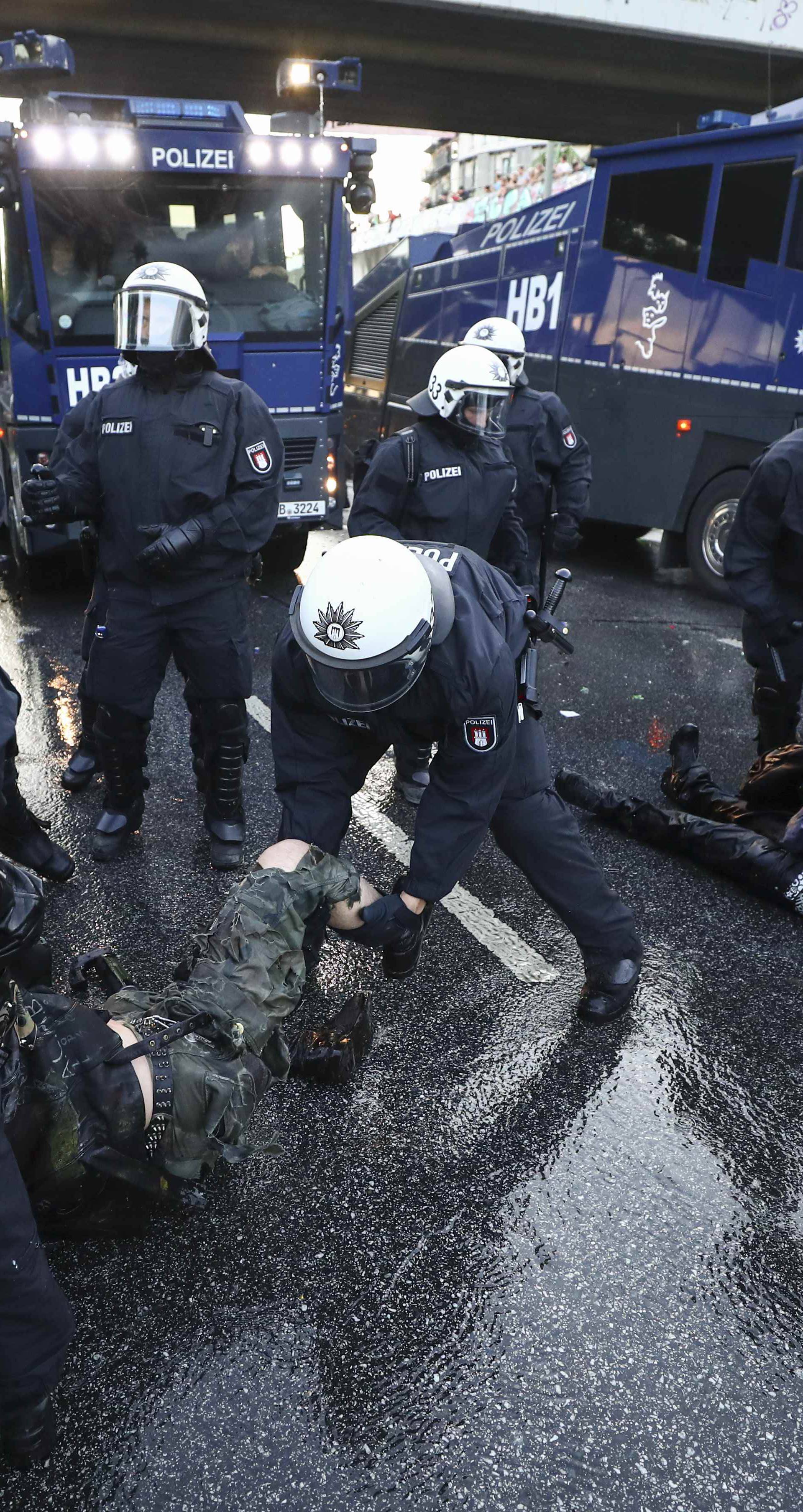 German riot police detain protesters during the demonstrations during the G20 summit in Hamburg