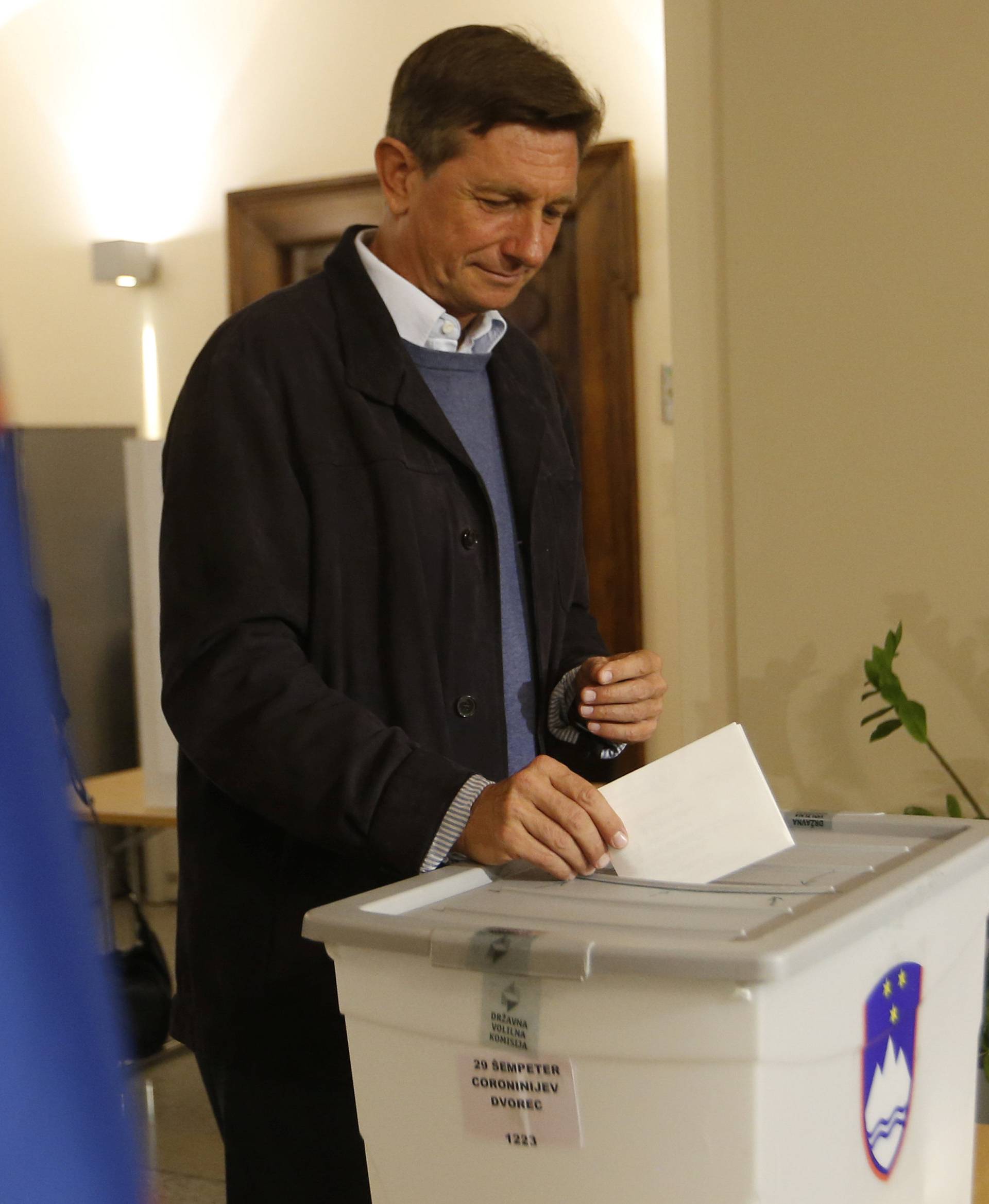 Presidential candidate Borut Pahor casts his ballot at a polling station during the presidential election in Sempeter pri Novi Gorici