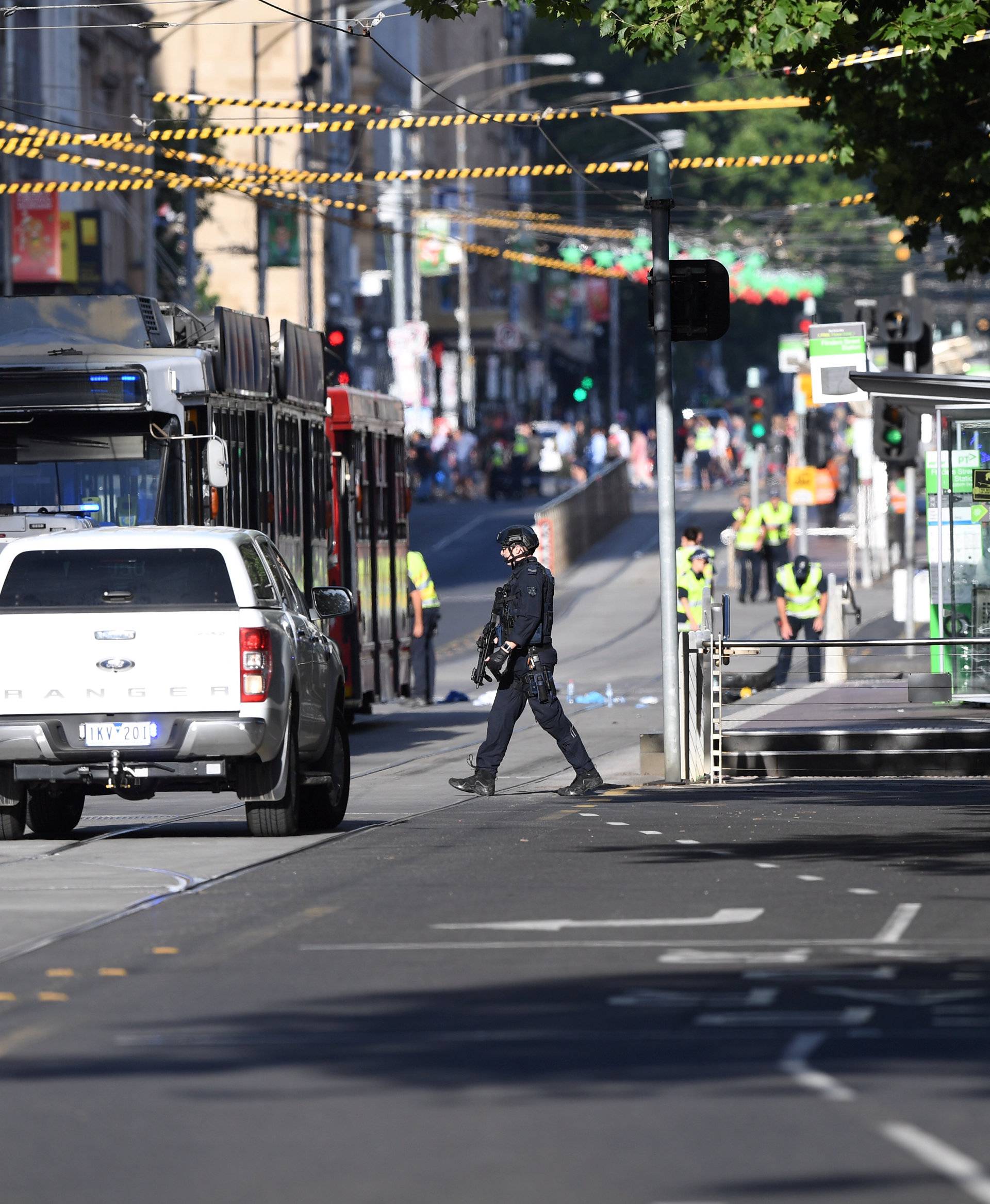 Wrecked car is seen at the scene of an incident involving a vehicle on Flinders Street, in Melbourne