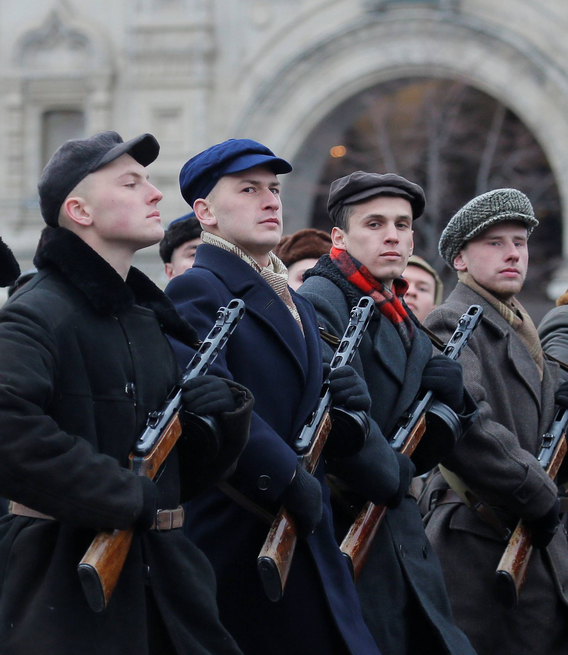 Performers dressed as militia take part in a military parade marking the anniversary of the 1941 parade, when Soviet soldiers marched towards the front lines of World War Two, in Red Square in Moscow