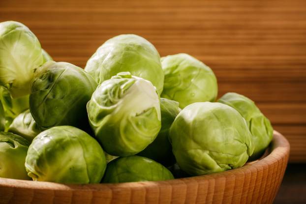 Brussels sprouts on a rustic wooden background