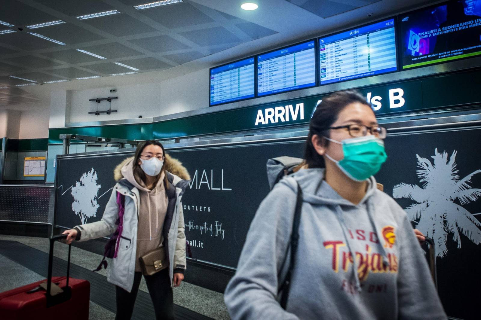Arrival in Milan Malpensa of the last two planes from China people in customs mask blocked to prevent the Corona Virus