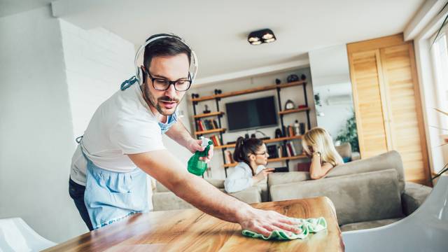 Husband housekeeping and cleaning concept. A man cleans the hous