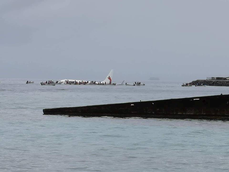 People are evacuated from an Air Niugini plane which crashed in the waters in Weno, Chuuk, Micronesia