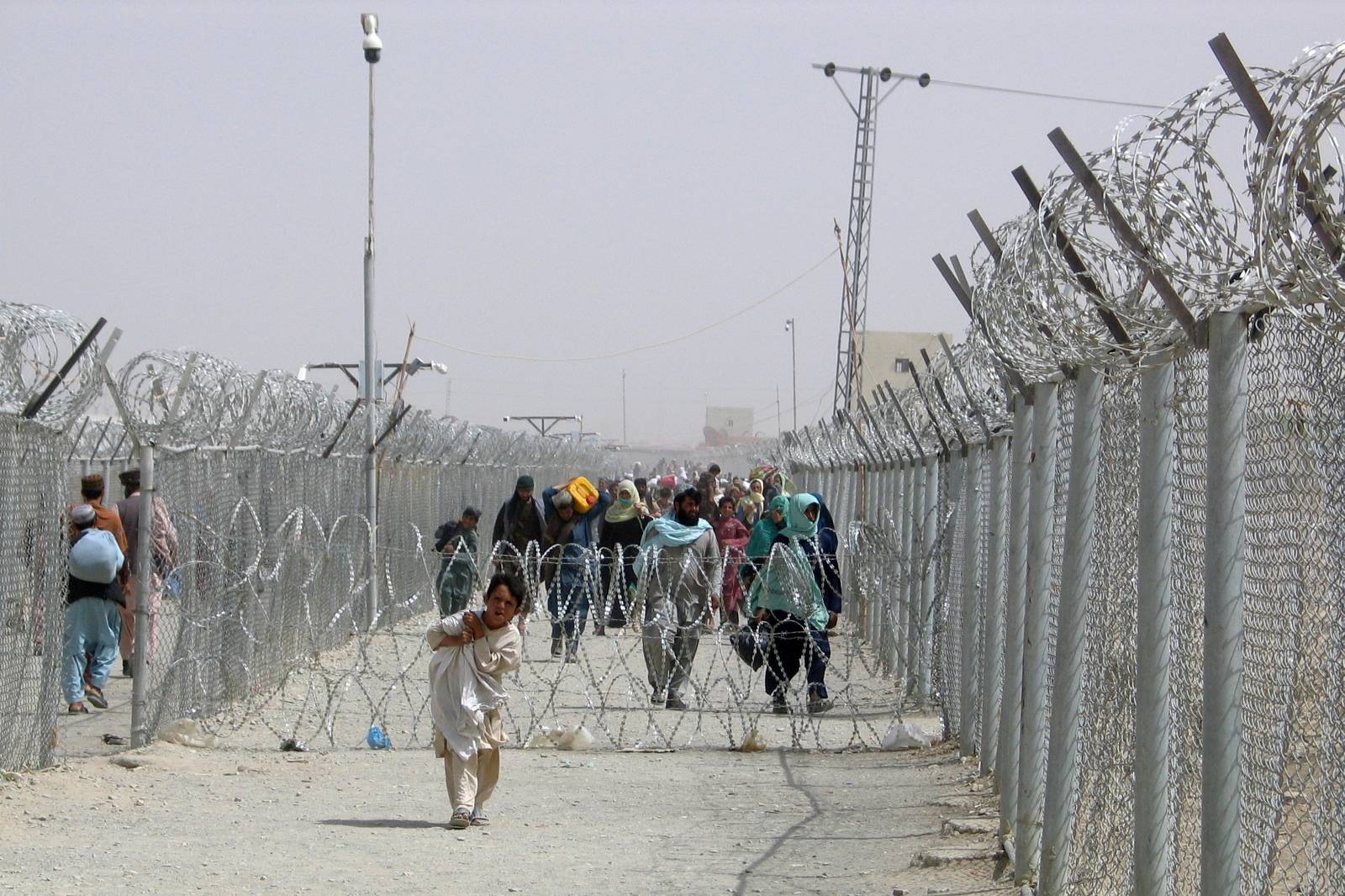 FILE PHOTO: People cross Friendship Gate at Pakistan-Afghanistan border town of Chaman