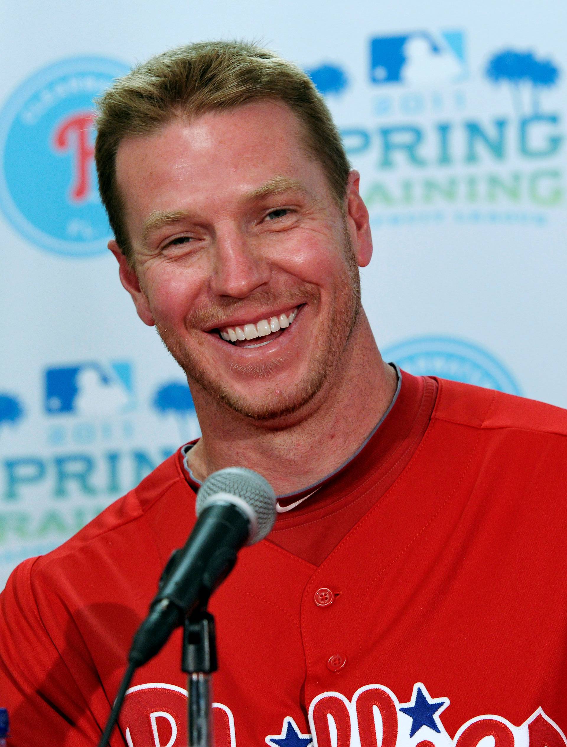 FILE PHOTO: Philadelphia Phillies starting pitcher Roy Halladay laughs during a news conference in Clearwater