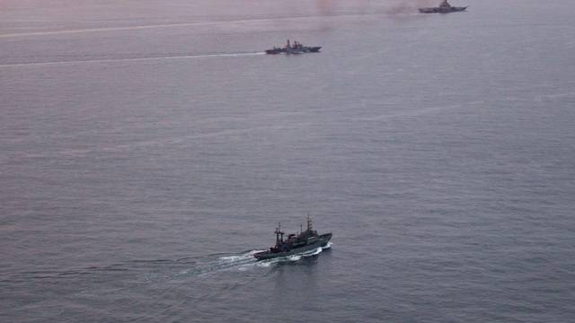 A photo taken from a Norwegian surveillance aircraft shows a group of Russian navy ships in international waters off the coast of Northern Norway